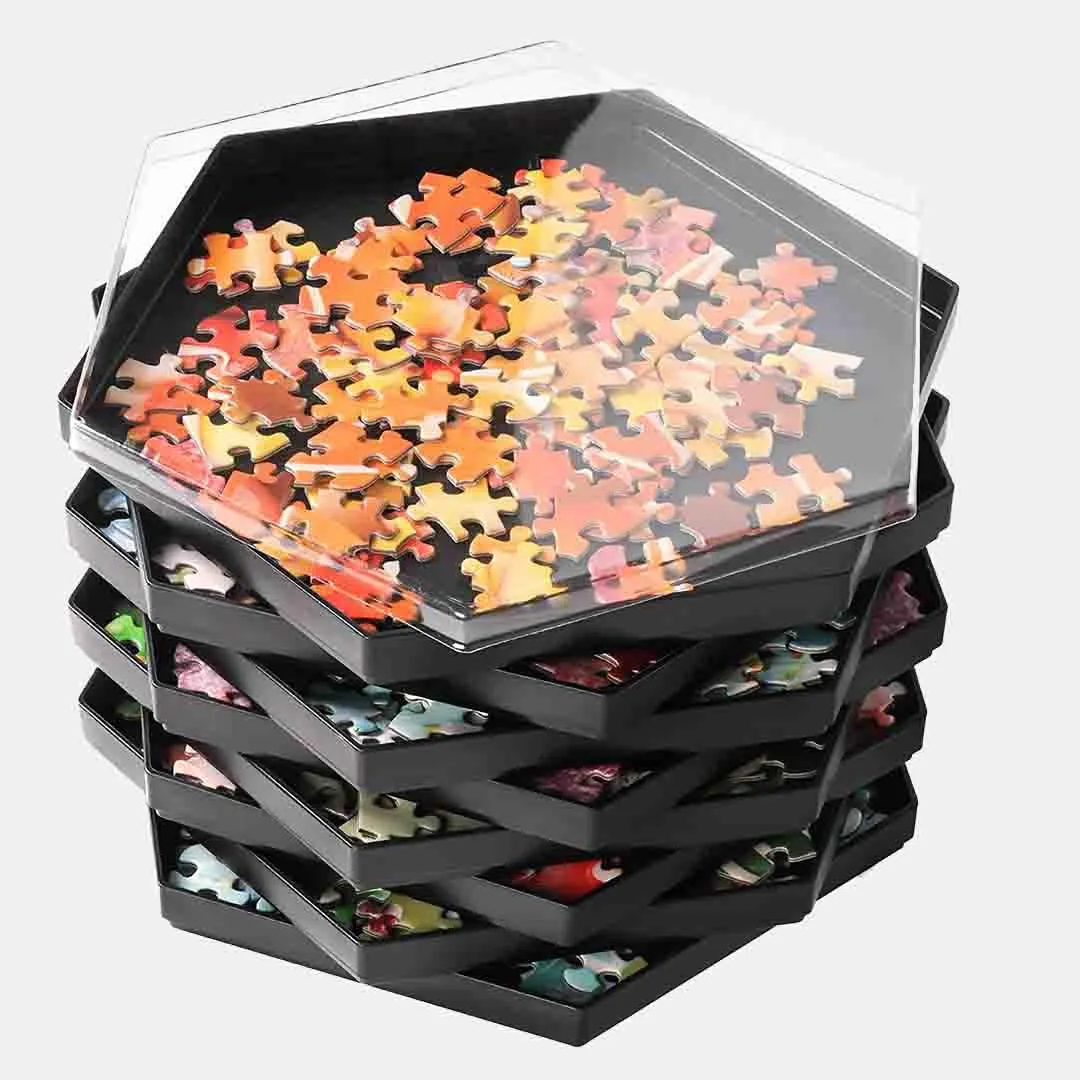 Stack of black hexagonal Becko puzzle sorting trays with a clear lid