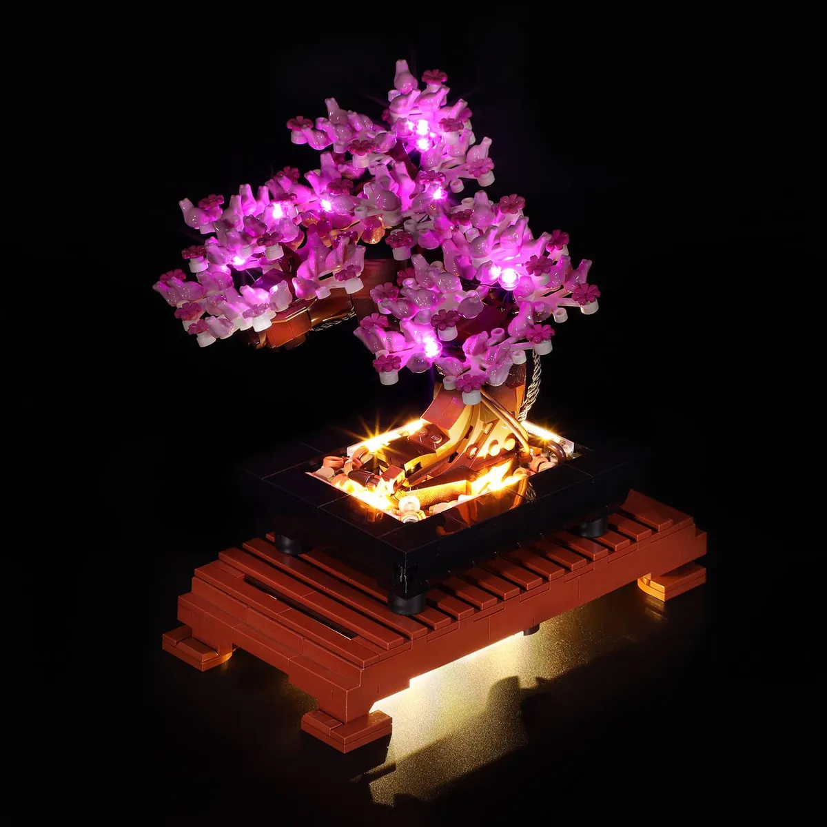 LEGO Bonsai Tree lit up with the Briksmax LED light kit in a dark room