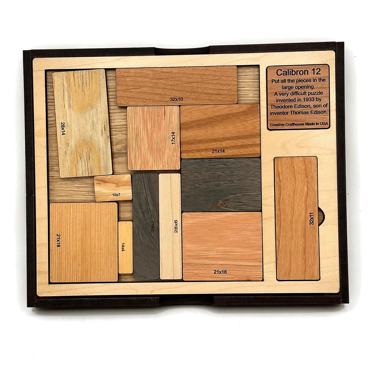 Calibron 12 wooden packing puzzle with twelve wooden blocks in its tray