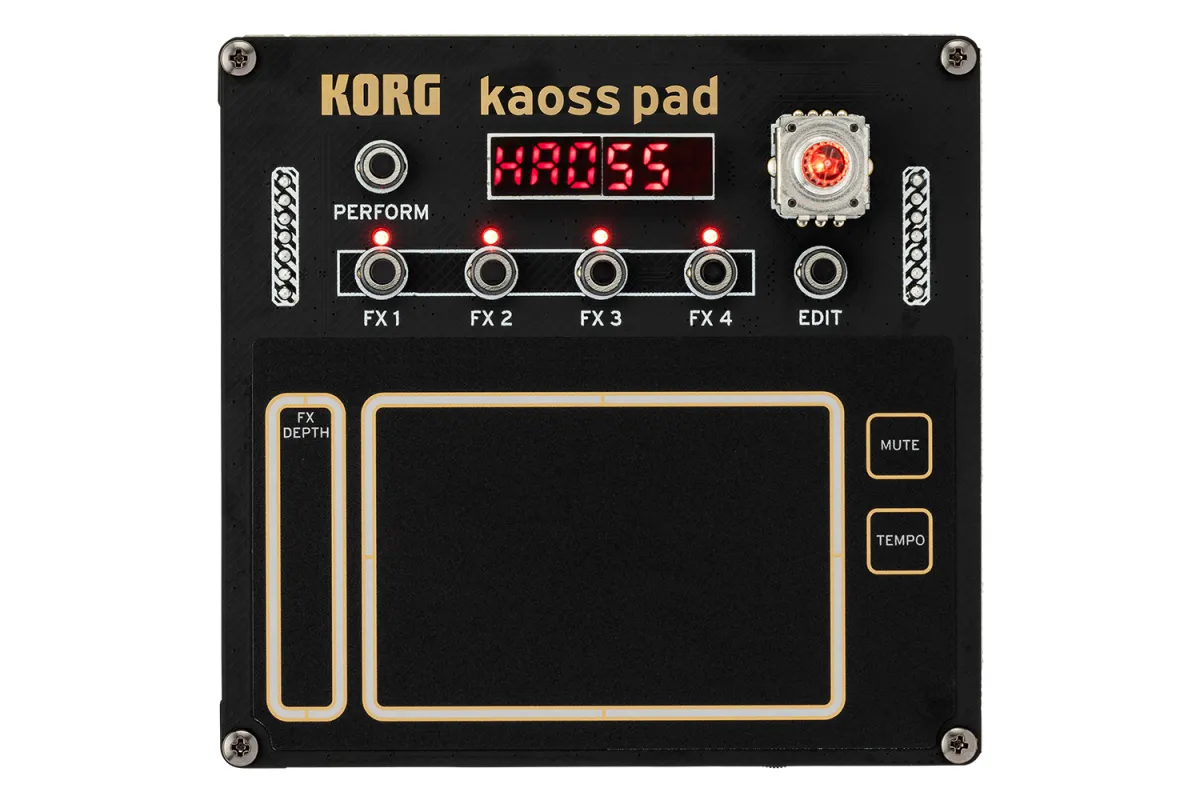 The Korg NTS-3 Kaoss Pad kit seen from above, with four effect knobs, a red LED display and a large gold-edged touchpad