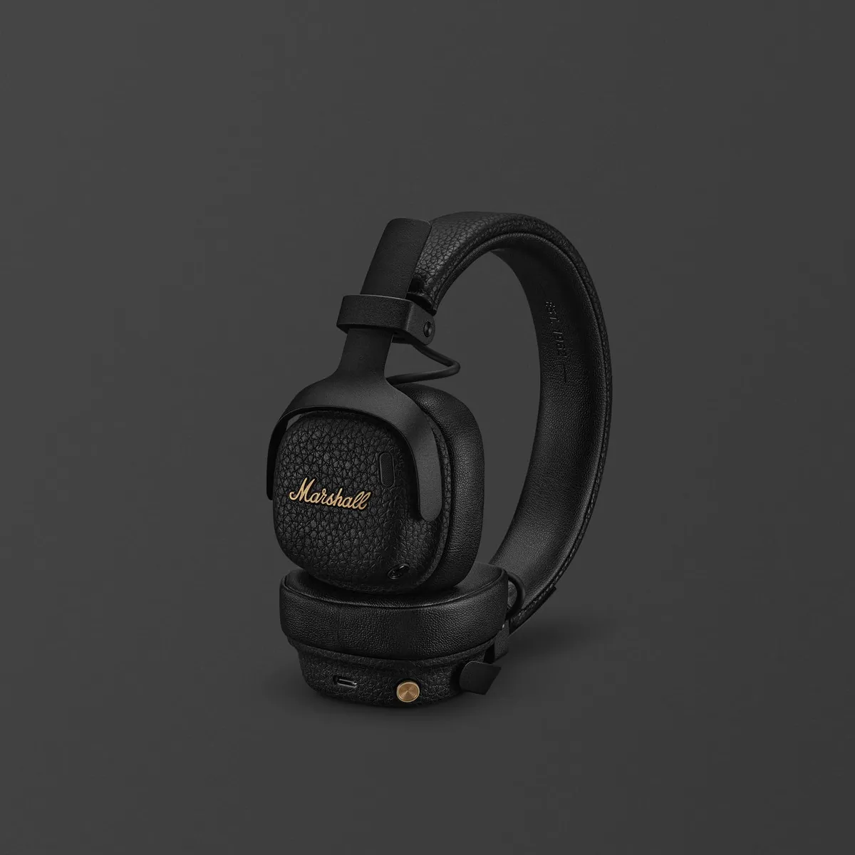 The Marshall Milton A.N.C. on-ear headphones in black with the gold Marshall script on the ear cup