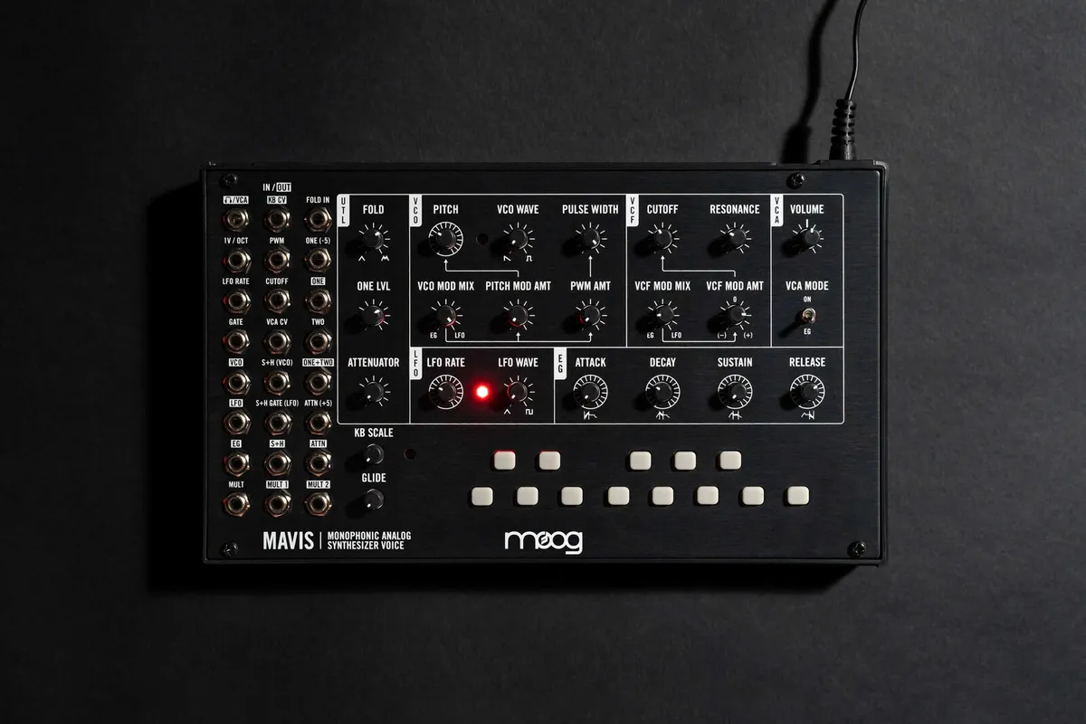 The assembled Moog Mavis synthesizer from the front, a black panel with knobs, patch points and a row of white keypad buttons