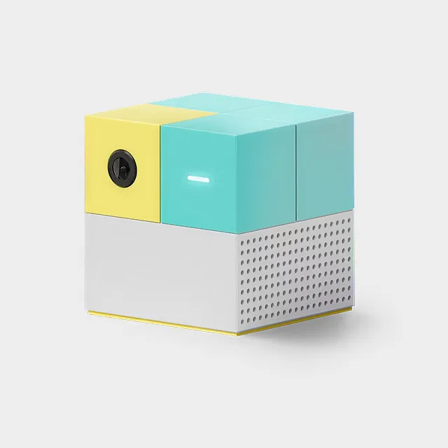 Nex Playground console, a small cube in yellow, turquoise and white with a camera on the front