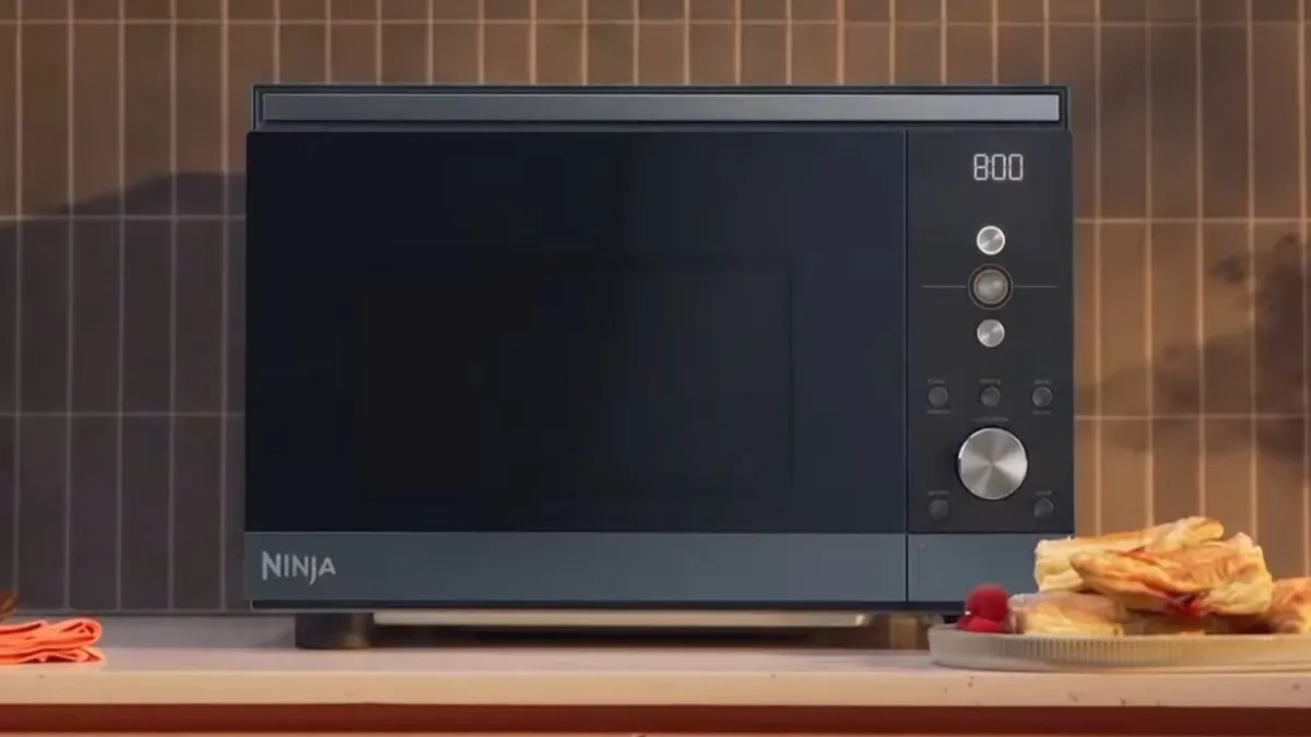 Ninja Crispi Microwave and air fryer in a dark blue-grey finish, front view