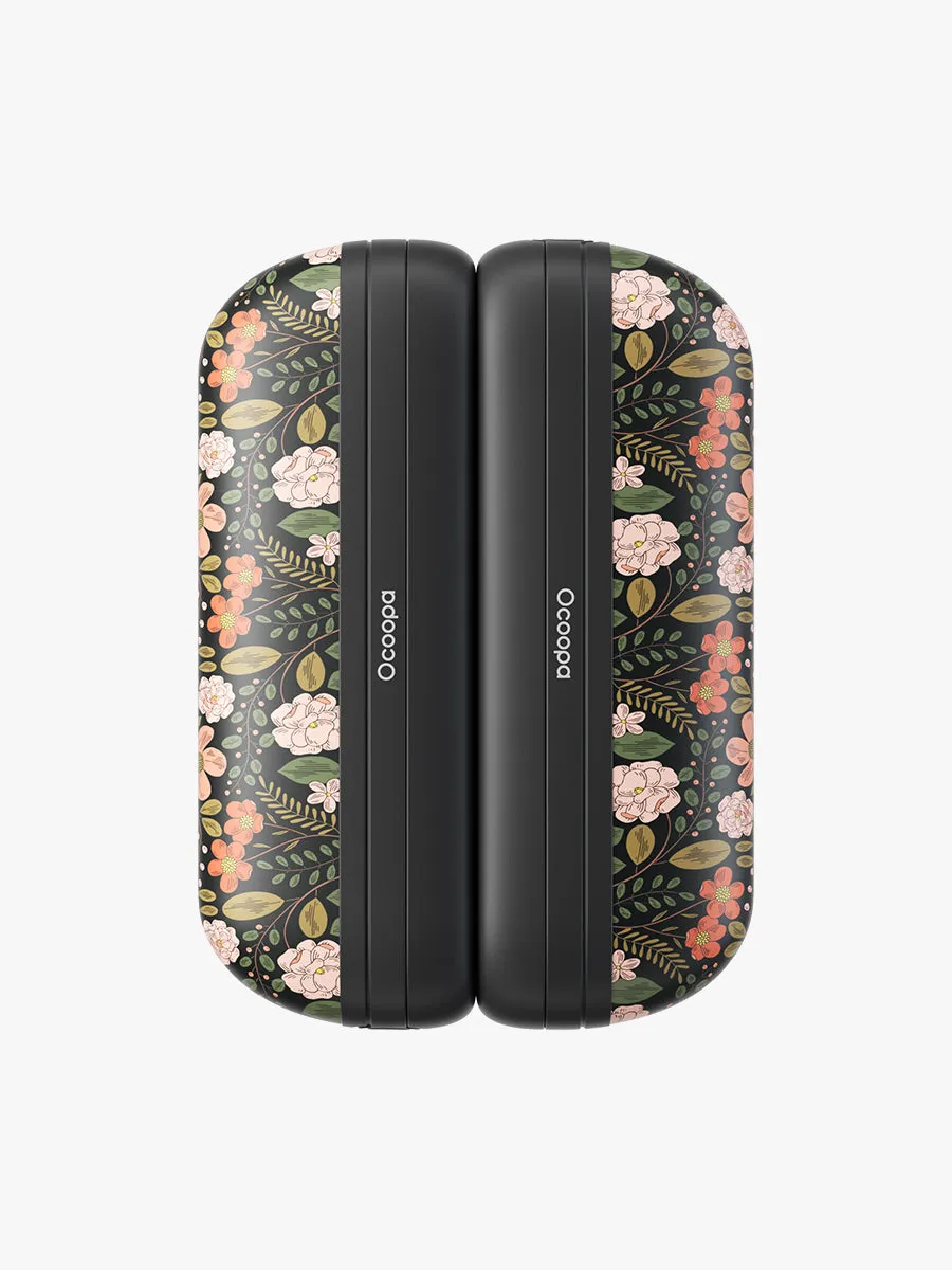 Ocoopa UT2s Mini hand warmers in the floral City Garden design, snapped together