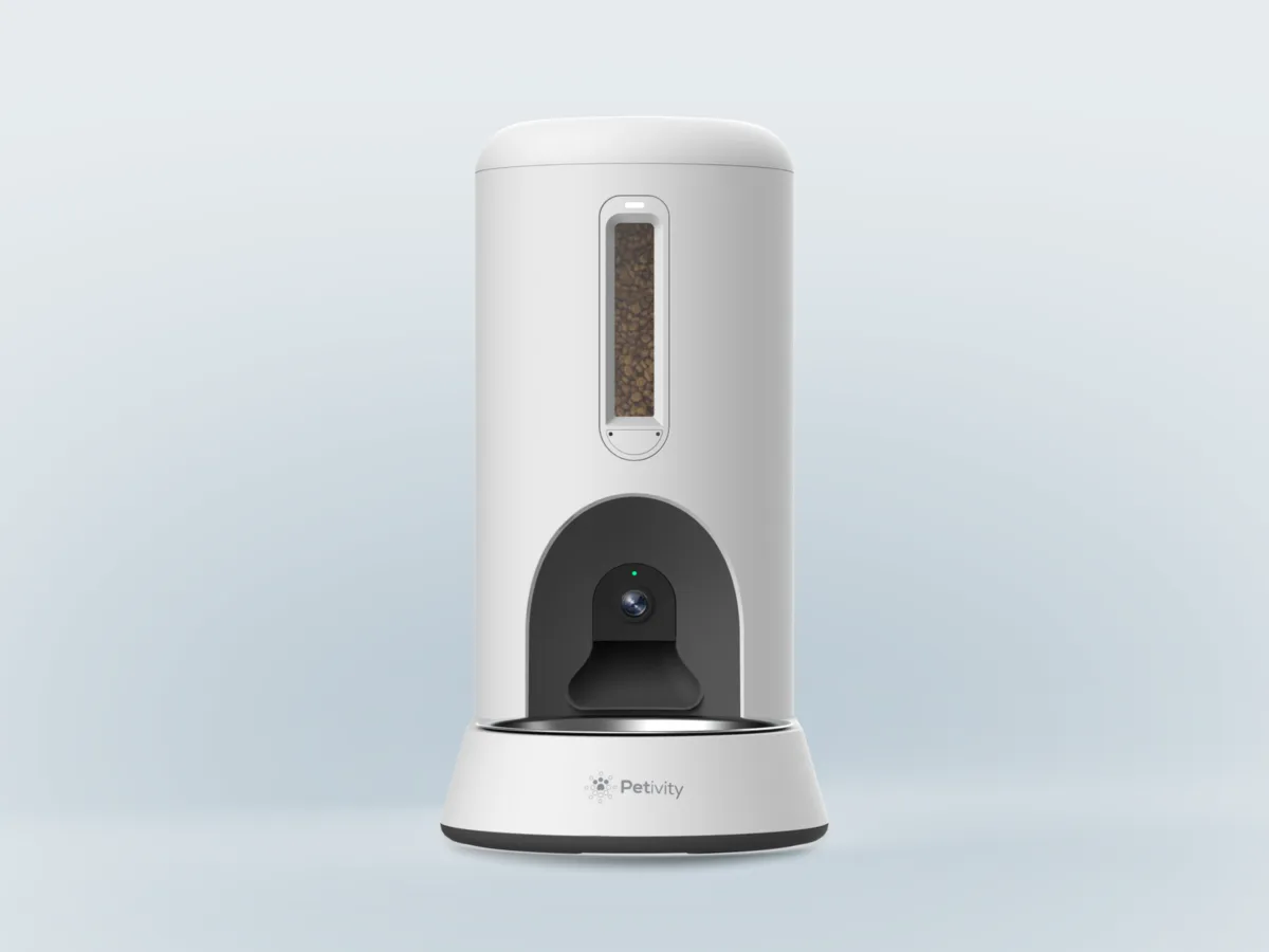 Petivity Smart Feeder for Cats, a white automatic feeder with a kibble window, a camera above the bowl and a steel bowl