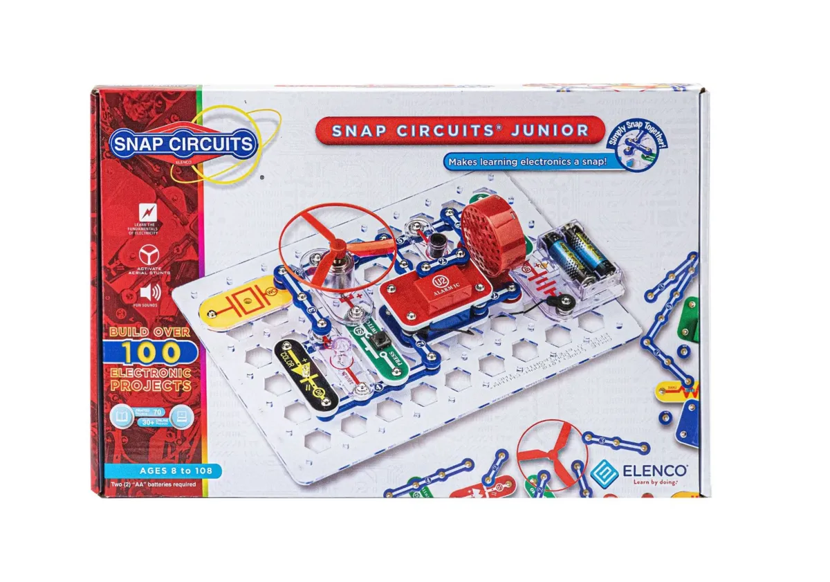 The Snap Circuits Jr. SC-100 box with colorful snap-together electronic parts on a white grid
